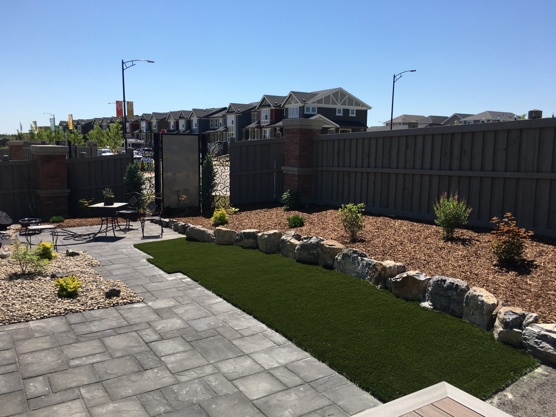 Synthetic turf for backyard landscaping, Leduc